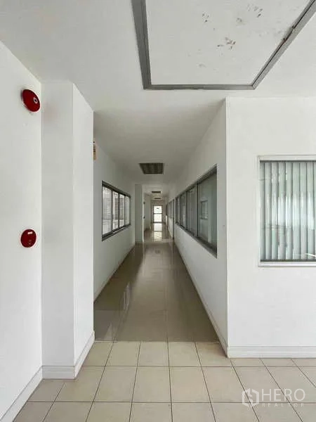 Warehouse for rent in Lat Krabang, Bangkok - Front elevation of a two-storey office building in a warehouse compound with parking apron.