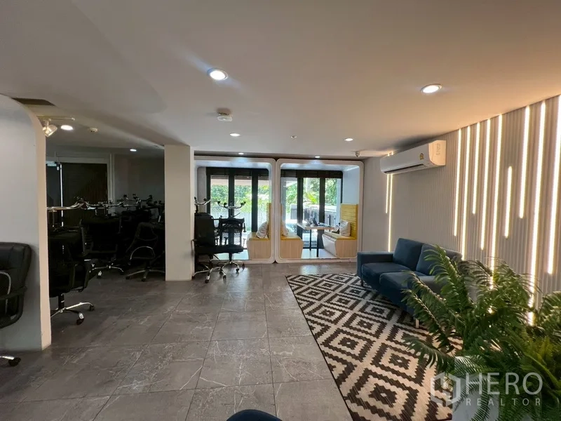 Home Office for rent or sale in Phra Khanong, Bangkok - Work zone with office chairs and glass doors to terrace seating pods.