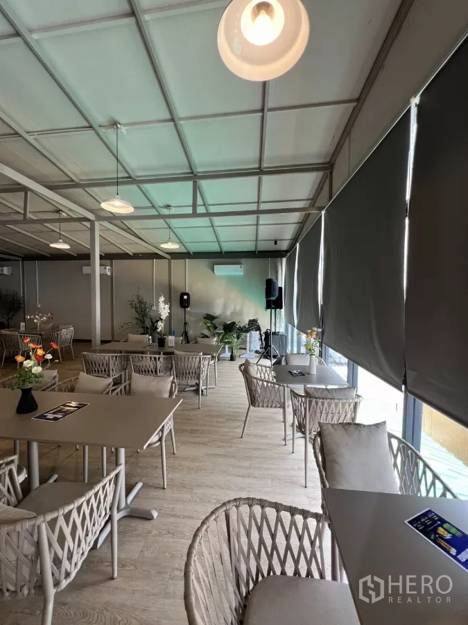 Retail Space for rent in Khlong Toei, Bangkok - Long event-ready dining area with roller blinds, pendant lights, light wood floors and speakers.