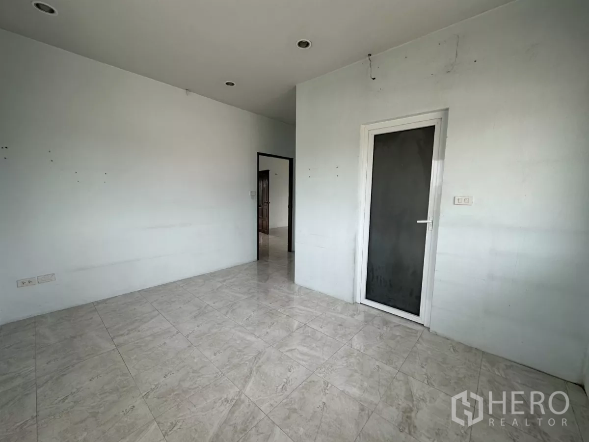 Home Office for rent - Tiled bathroom with shower, water heater, sink and toilet.