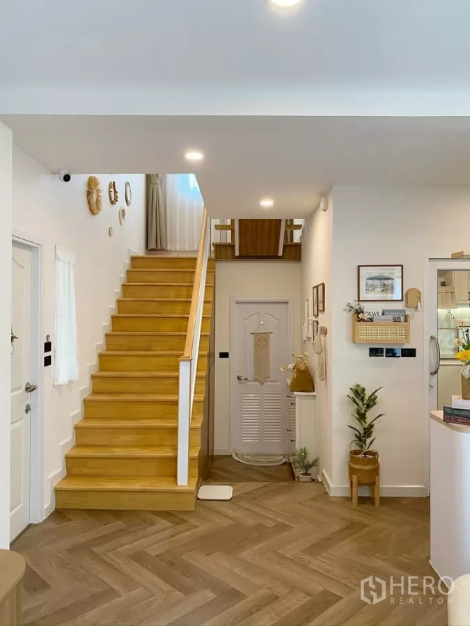 Detached House for sale in Sai Mai, Bangkok - Wide view of stair hall connecting living area to the upper floor.