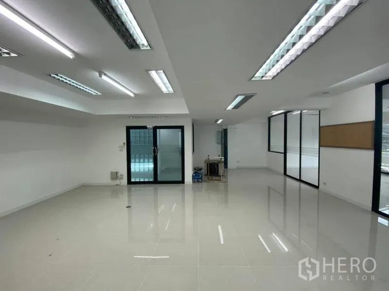 Office Space for rent in Suan Luang, Bangkok - Bright meeting or workspace with sliding glass door and tiled flooring.