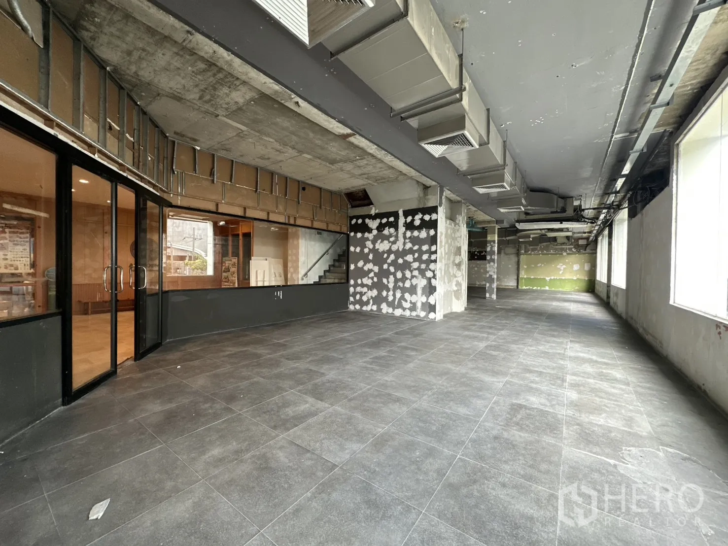 Retail Space for rent in Watthana, Bangkok - Deep retail space lined with windows bringing natural light.