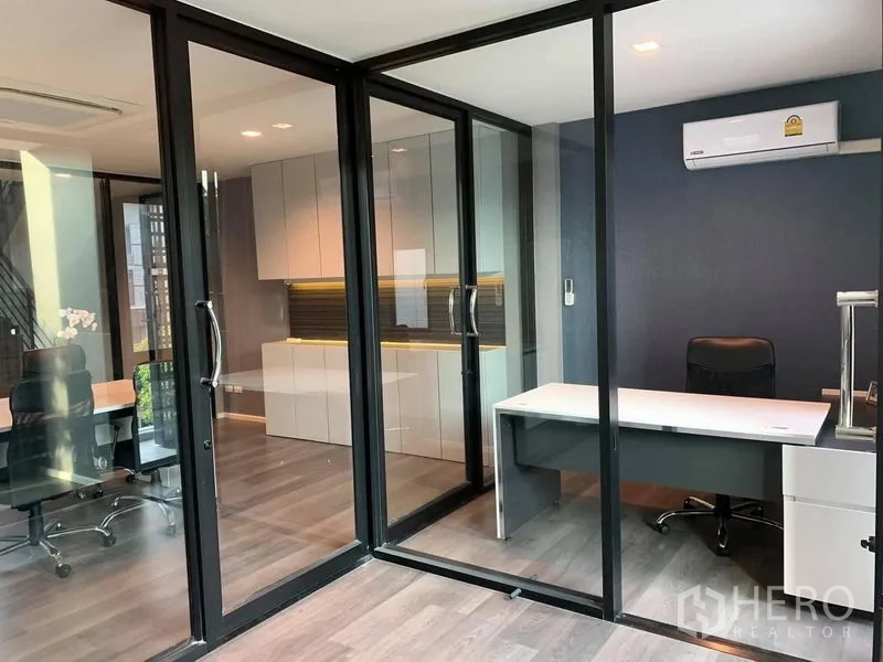 Home Office for rent - Private office behind floor-to-ceiling glass with desk, storage cabinets and air-conditioning.