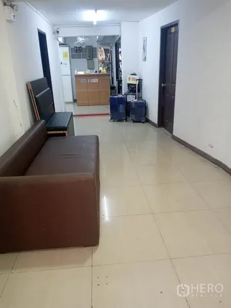 Retail Space for rent in Khlong Toei, Bangkok - Long hallway with seating and a reception counter at the far end.