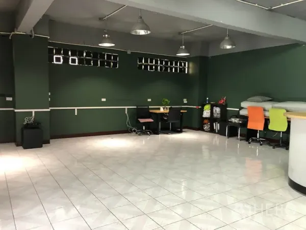 Warehouse for rent in Chatuchak, Bangkok - Spacious multipurpose hall with dark green walls, pendant lights and glossy tile floor.