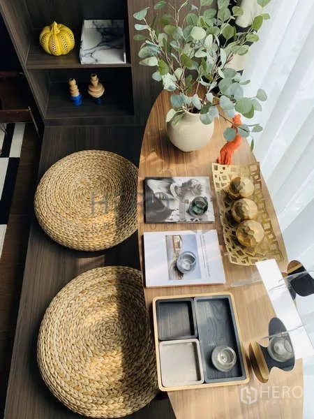Condominium for rent - Styled tabletop with trays, greenery and woven seats in the Zen nook.