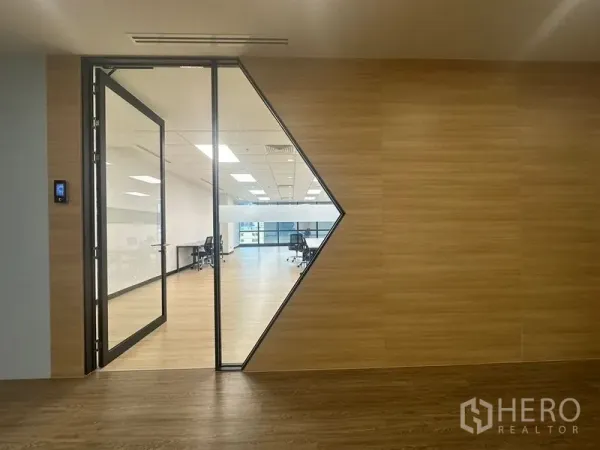 Office Space for rent in Chatuchak, Bangkok - Glass-entry office with wood feature wall and geometric window in Chatuchak, Bangkok.