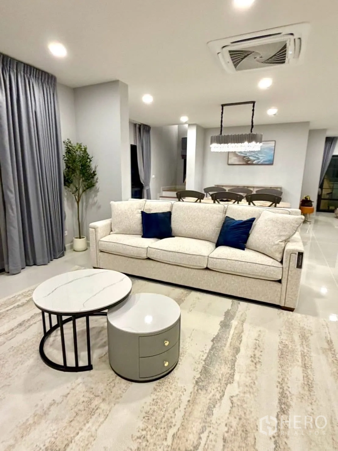 Detached House for rent in Bang Phli, Samut Prakan - Spacious living zone with sofa, coffee tables, and recessed ceiling lights.