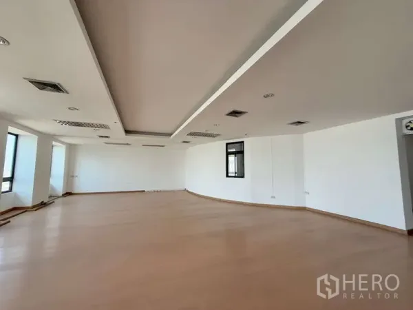 Office Space for rent in Chatuchak, Bangkok - Spacious work or meeting area with recessed ceiling and a feature window.