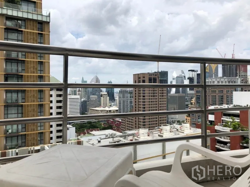 Condominium for rent in Pathum Wan, Bangkok - High-floor balcony view of Bangkok skyline and surrounding towers.