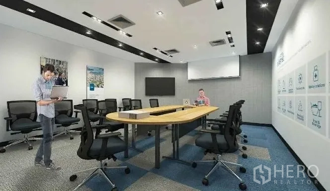 Office Space for rent in Chatuchak, Bangkok - Boardroom with long conference table, swivel chairs and ceiling spotlights.