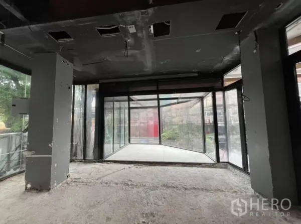 Retail Space for rent - Interior view toward a corner glass vestibule creating a high-visibility display bay at the shopfront.