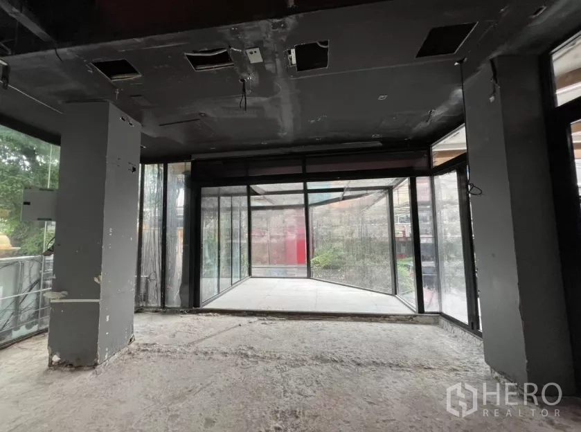 Retail Space for rent - Interior view toward a corner glass vestibule creating a high-visibility display bay at the shopfront.