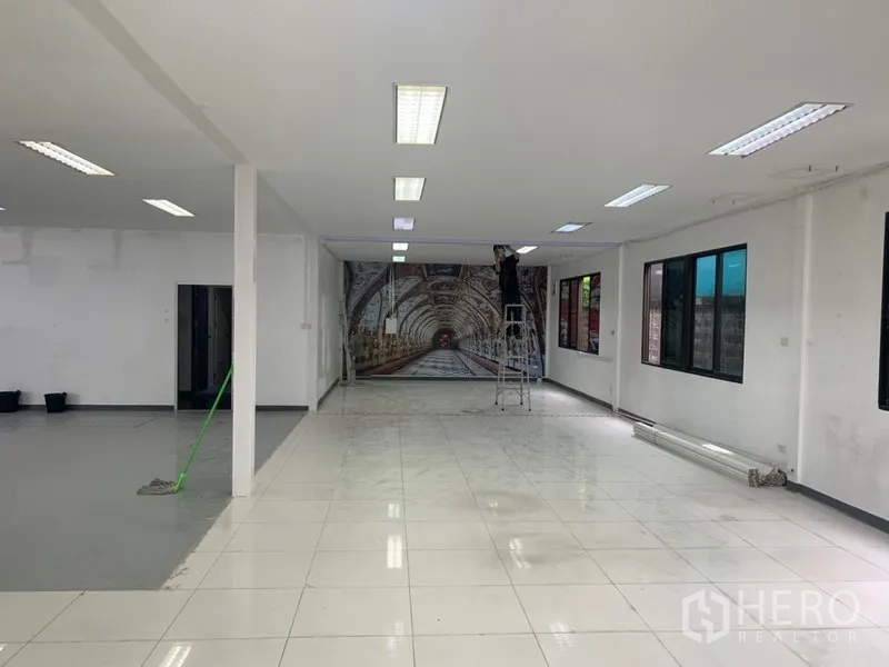 Warehouse for rent in Suan Luang, Bangkok - Long tiled office hall connected to the warehouse via wide opening