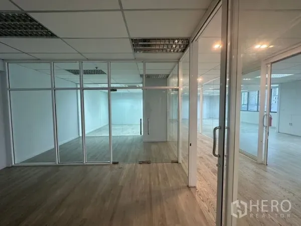 Office Space for rent in Din Daeng, Bangkok - Series of glass offices with double doors and wood flooring.