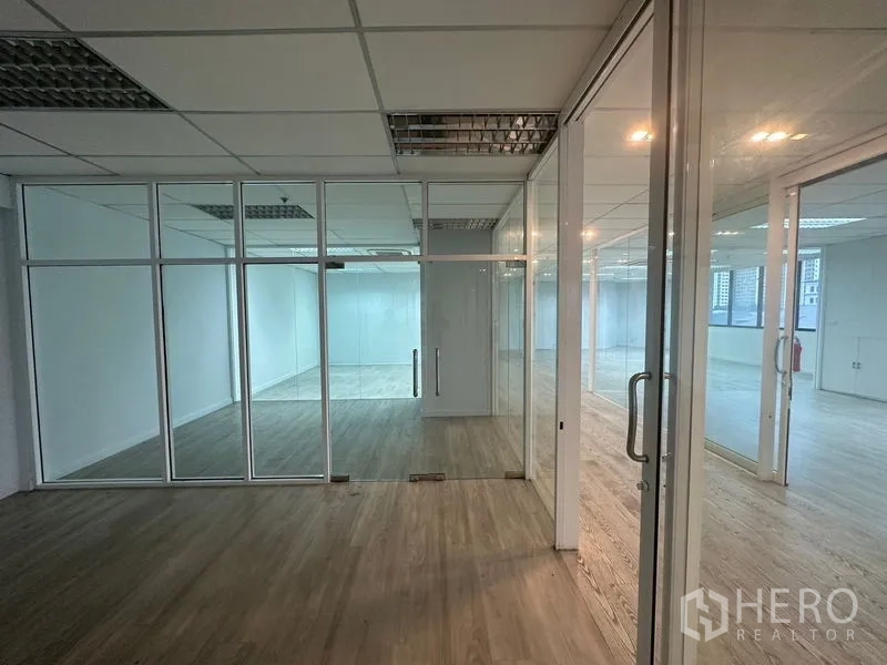 Office Space for rent in Din Daeng, Bangkok - Series of glass offices with double doors and wood flooring.