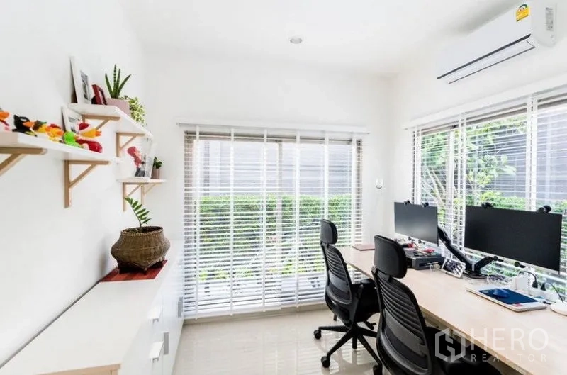 Detached House for rent - Home office with two desks, dual monitors, wall shelves, and large windows with blinds.