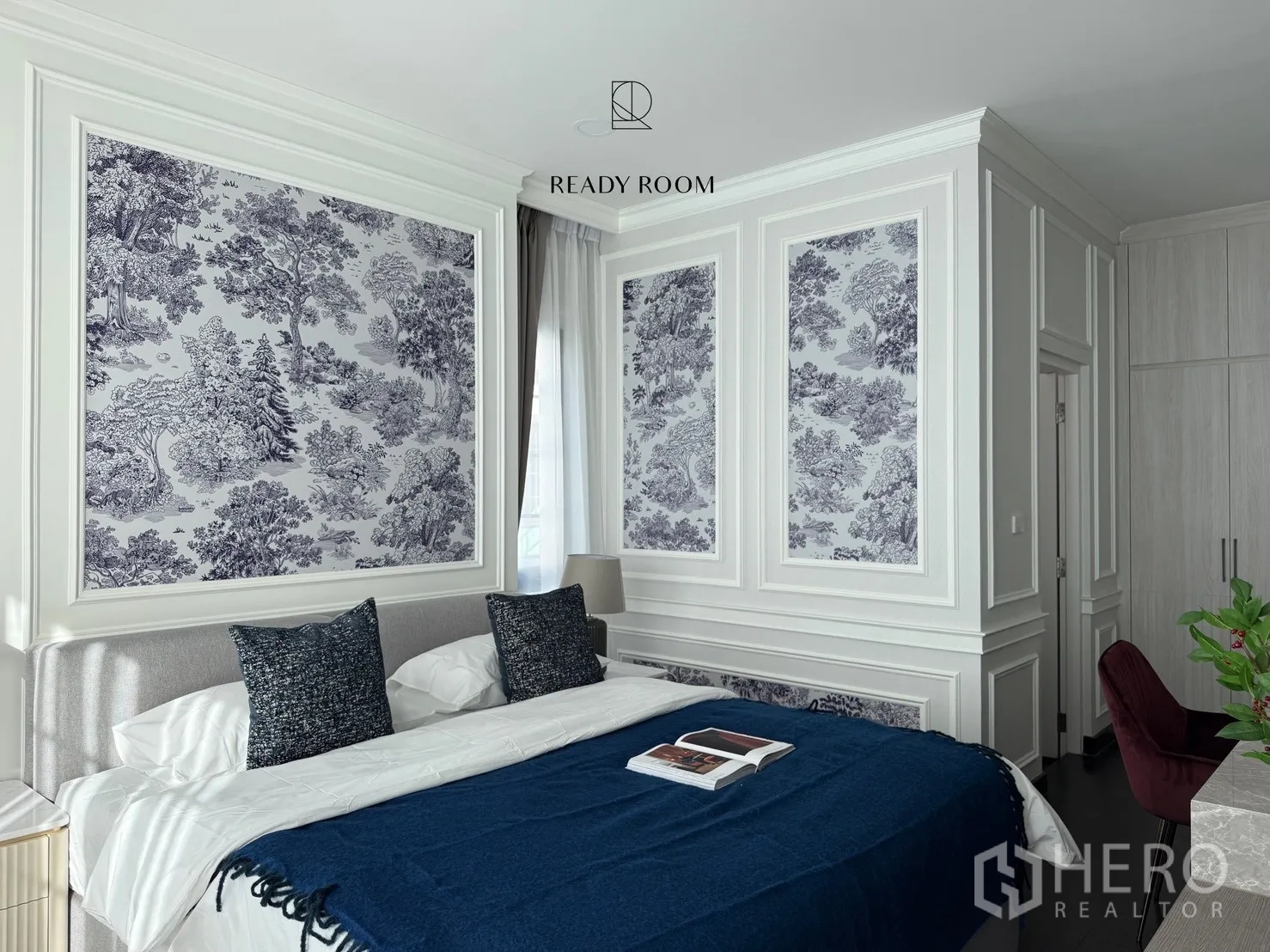 Detached House for rent or sale in Bang Phli, Samut Prakan - Sunlit master bedroom with king bed, blue throw and decorative wall panels with toile prints.