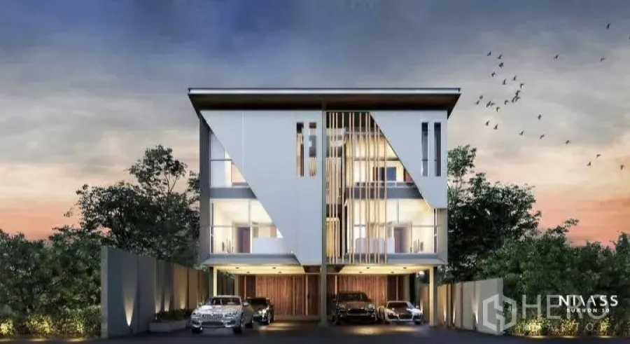 Detached House for sale in Lat Phrao, Bangkok - Twilight front elevation of a modern three-storey detached house with covered parking in Lat Phrao.