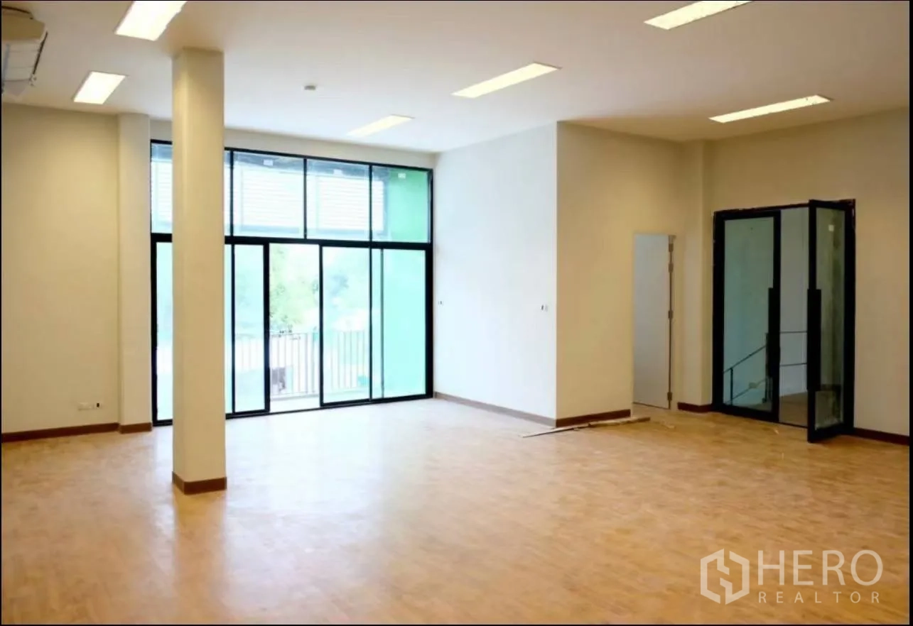 Factory for rent in Samut Prakan - Bright office lobby with full-height sliding glass doors and separate entry.