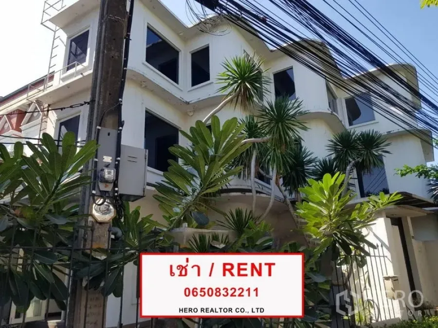 Office Space for rent in Phra Khanong, Bangkok - Three-storey office building exterior with bay windows, tropical plants and RENT signage.