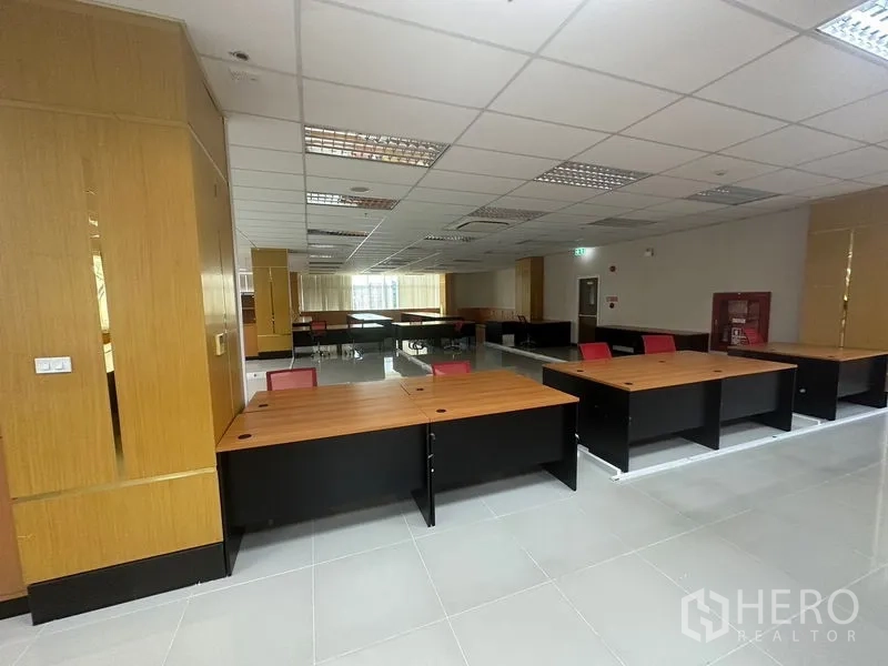 Office Space for rent in Suan Luang, Bangkok - Workstations near columns in an open office with emergency equipment cabinet