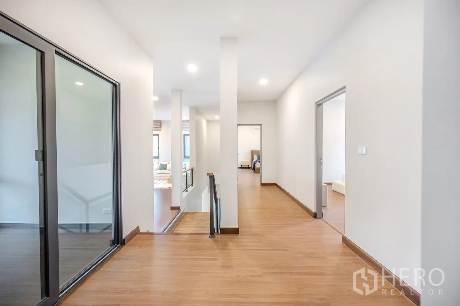 Detached House for rent in Bang Phli, Samut Prakan - Bright upstairs corridor with wood floors and multiple rooms