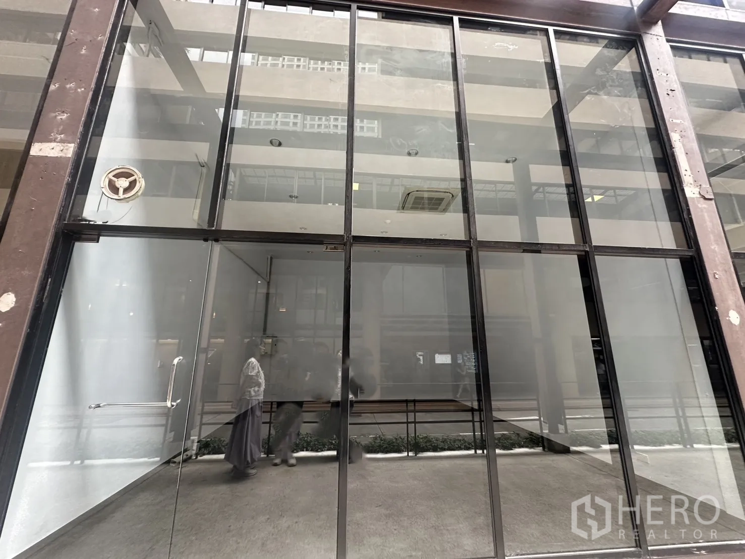 Retail Space for rent in Watthana, Bangkok - Full-height glass storefront with metal framing and glass door of a retail unit.