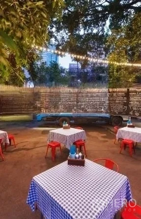 Retail Space for rent in Watthana, Bangkok - Outdoor dining zone with checkered tablecloths under festoon lights.
