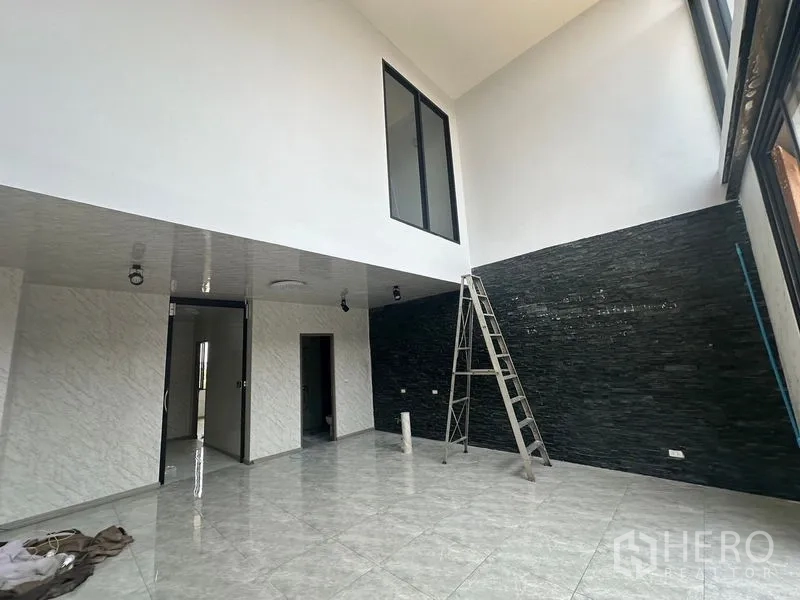 Home Office for rent - Grand atrium space with high ceiling, internal window and polished tile floor.