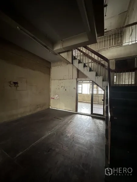 Shophouse for rent or sale in Watthana, Bangkok - Corridor beside staircase leading to upper rooms in the shophouse.
