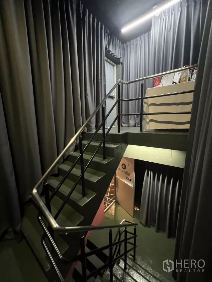 Retail Space for rent - Another view of the curtained staircase and landing area.