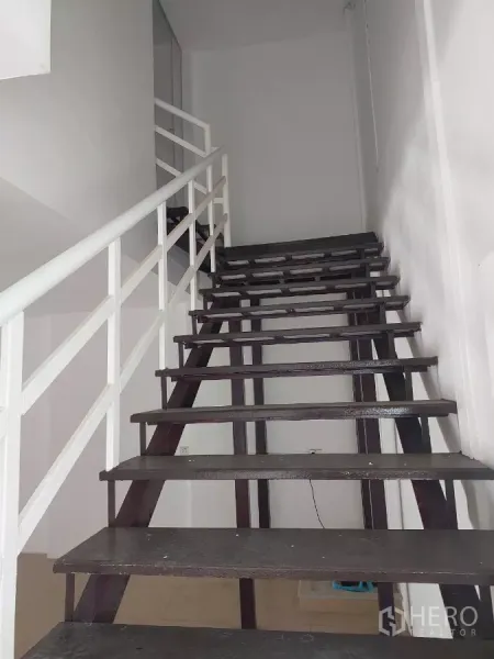 Home Office for rent in Yan Nawa, Bangkok - Internal staircase with white railing leading to the upper floors.