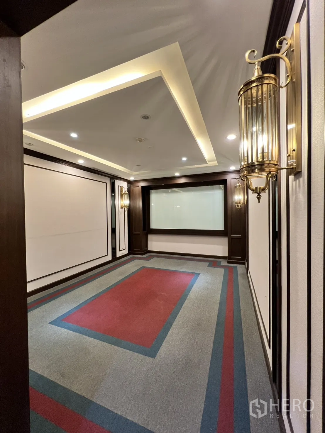Office Space for rent in Watthana, Bangkok - Carpeted meeting room with cove lighting and wood accents.