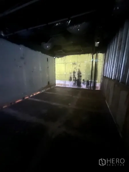 Retail Space for rent in Bang Rak, Bangkok - Enclosed back room or mezzanine area with window and unfinished surfaces.