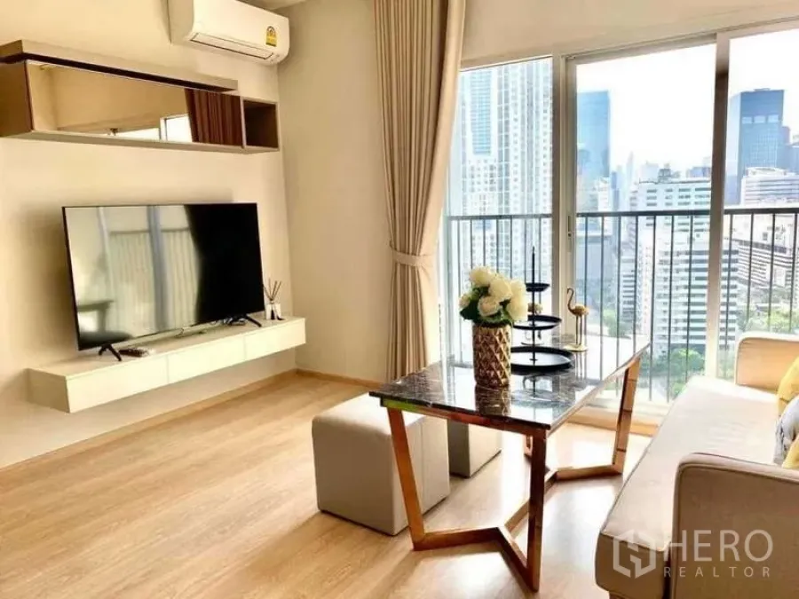 Condominium for rent - City skyline viewed from the condo’s balcony and living area