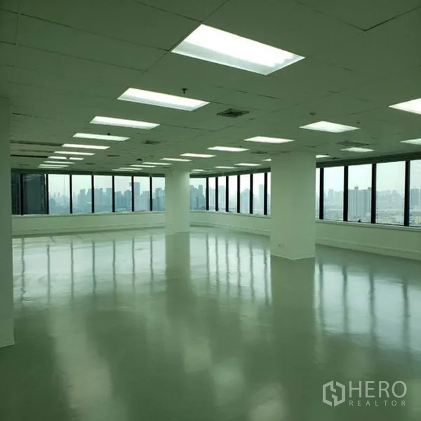 Office Space for rent in Watthana, Bangkok - Open-plan office with polished floors, LED panel lighting, and wraparound windows offering Bangkok skyline views.