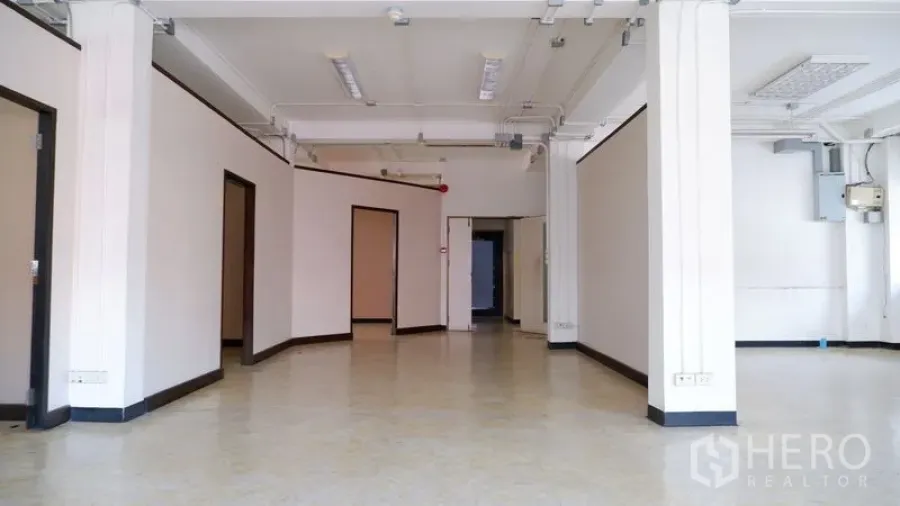 Office Space for rent in Watthana, Bangkok - Central view of the office showing wide corridor, multiple doorways, and bright open area.