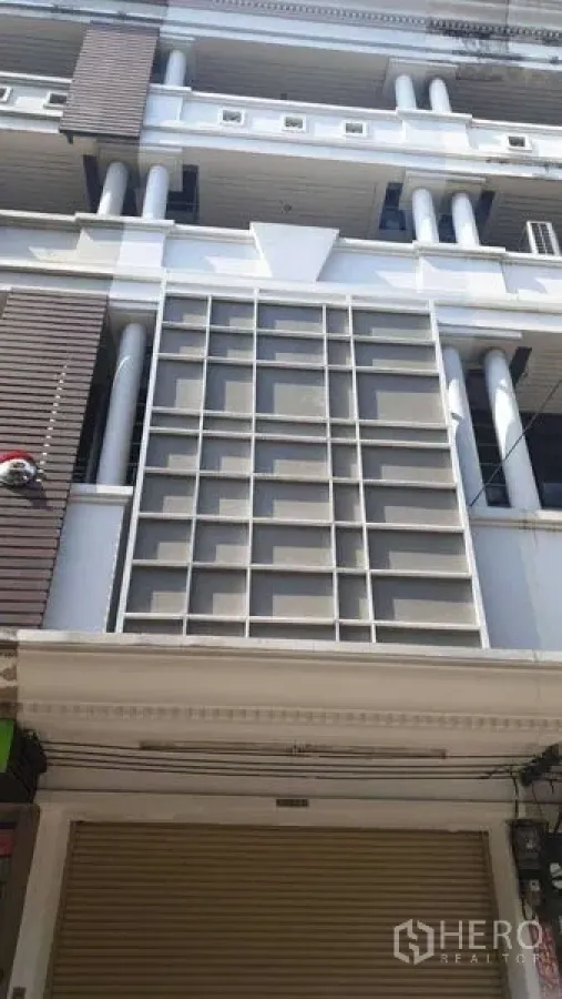 Home Office for rent or sale in Suan Luang, Bangkok - Multi-storey townhouse facade with ground-floor shutter in Bangkok.