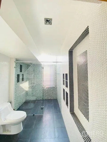 Detached House for rent in Suan Luang, Bangkok - Mosaic-tiled bathroom with walk-in shower and dark flooring.