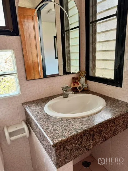 Home Office for rent in Khlong Toei, Bangkok - Top-down view of polished hardwood stairs and central void.