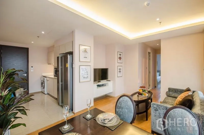 Condominium for rent or sale in Watthana, Bangkok - Open-plan living, dining and kitchen layout in a 2-bedroom condo.