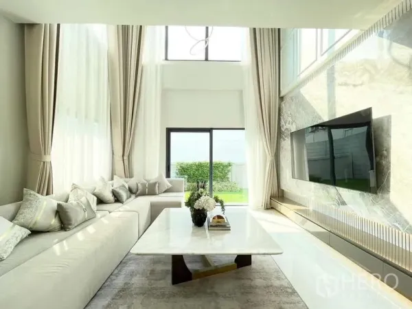 Detached House for rent in Bang Phli, Samut Prakan - Living room facing the garden with floor-to-ceiling windows and a sliding door.
