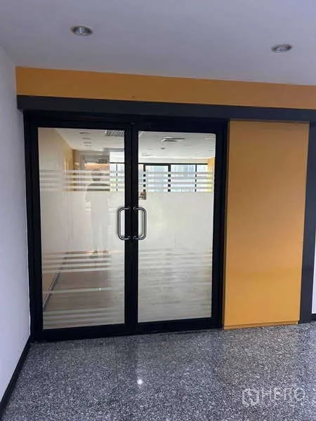 Office Space for rent in Khlong Toei, Bangkok - Office entrance with double glass doors and frosted stripes leading into the unit near BTS On Nut.