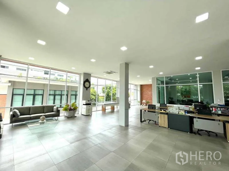 Factory for sale in Krathum Baen, Samut Sakhon - Bright open-plan office with desks, glass meeting rooms, and floor-to-ceiling windows.