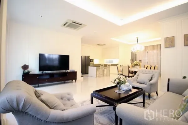 独立式住宅 出租或出售 - 开放式客厅连西式厨房与餐厅，白色调配岛台与水晶吊灯
