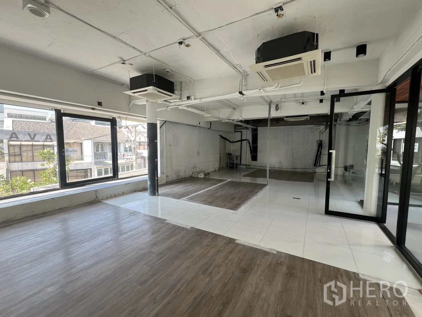 Retail Space for rent - Bright retail space featuring wide windows, ducted air-conditioning and a corner glass entrance.