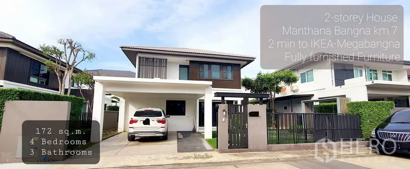 Detached House for rent in Bang Phli, Samut Prakan - Street-view facade of a two-storey detached house with gated entrance and carport