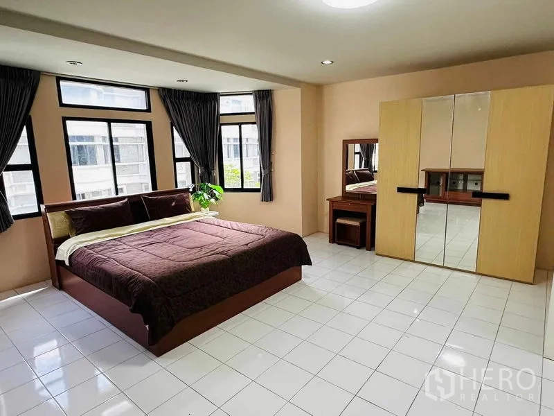 Home Office for rent - King bedroom with multiple windows, mirrored wardrobe and dressing table.